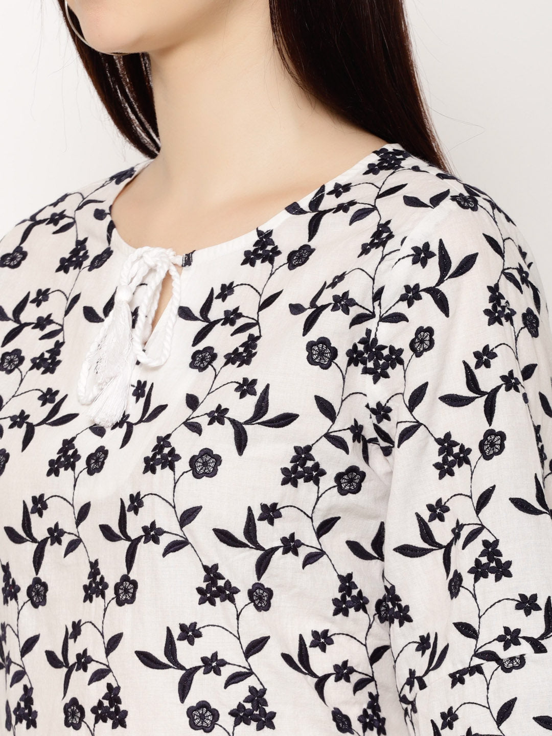 Floral Embroidered Tie-Up Neck Flared Sleeve Cotton Peplum Top